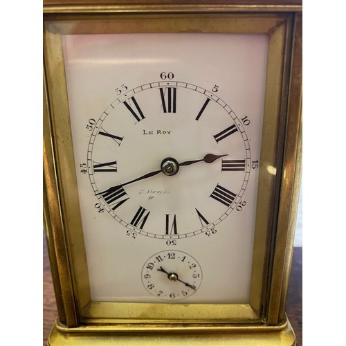 319 - A carriage clock retailed by Le Roy & Fils of London, white enamel dial alarm dial, striking movemen... 