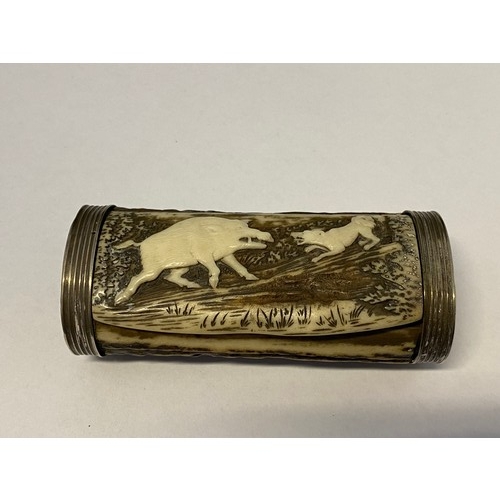 1320 - A snuff box made from an antler with carved decoration of a boar and dog