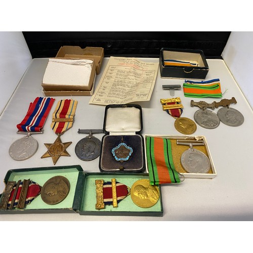 1319 - A group of three Second World War medals comprising:- War medal, Defence medal and Italy star, in bo... 