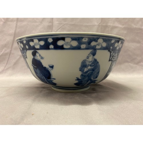 1193 - A Chinese 19th Century bowl decorated in blue and white with figures and landscapes in alternate res... 