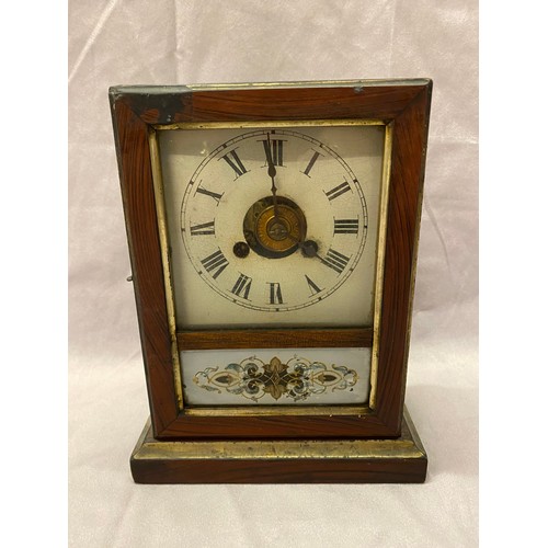 1331 - An American mantel clock with square enamel dial painted flowers, in a walnut finished case - 9 1/2i... 