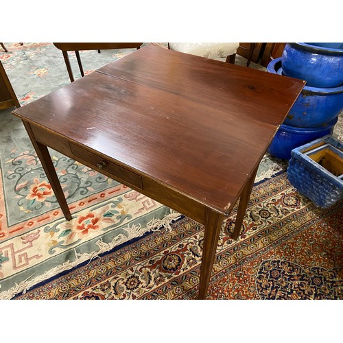 1070 - A Georgian mahogany tea table with rectangular folding top, frieze drawer - 36in. wide