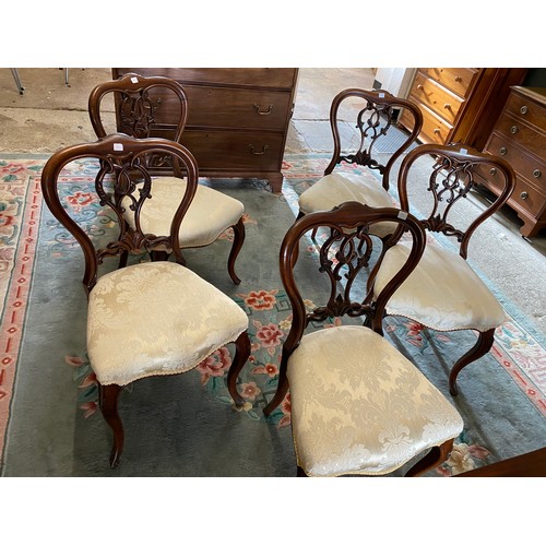 1058 - Five Victorian rosewood finished framed dining chairs with shaped backs, leaf carved scrolling centr... 