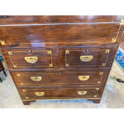 1041 - A 19th Century camphorwood and brass inlaid campaign chest with hinged writing surface, above two na... 