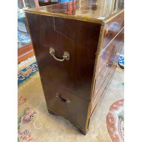 1041 - A 19th Century camphorwood and brass inlaid campaign chest with hinged writing surface, above two na... 