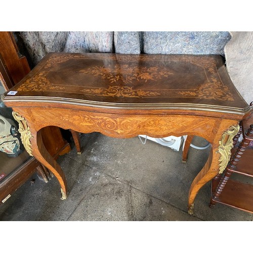 1040 - A 19th Century French kingwood and floral marquetry card table with rectangular top, on slender cabr... 