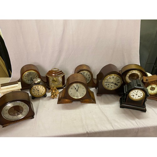 Five mantel clocks in oak cases, an American mantel clock in an oak