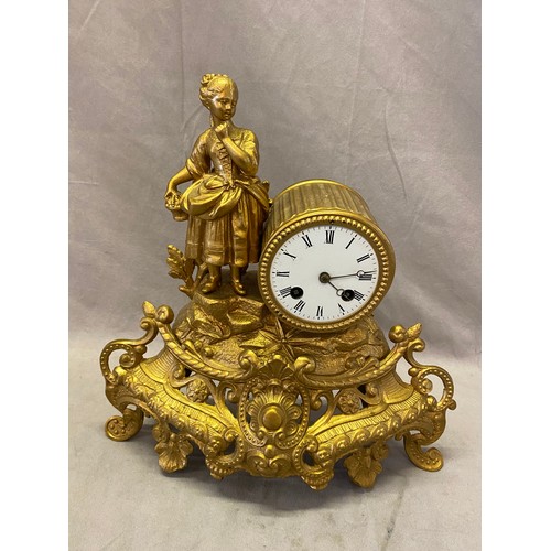 316 - A mantel clock with white enamel dial, striking movement on a bell, in a gold painted spelter case w... 