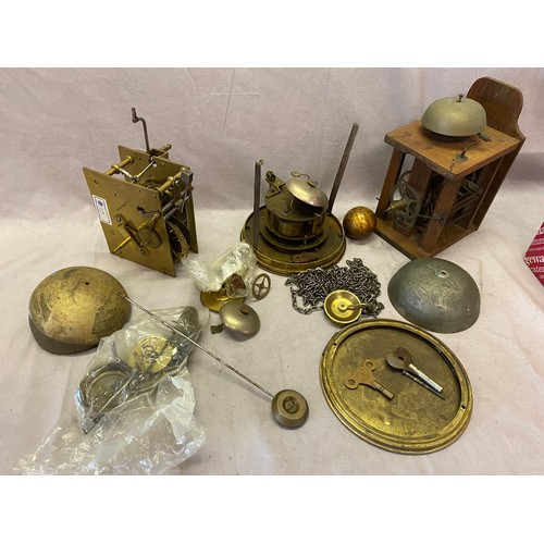 320 - A quantity of clock parts including movements, bells, hands, pendulums etc..