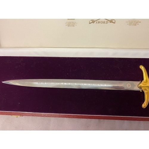 321 - A Wilkinson Sword miniature sword to commemorate D Day, in fitted leather box