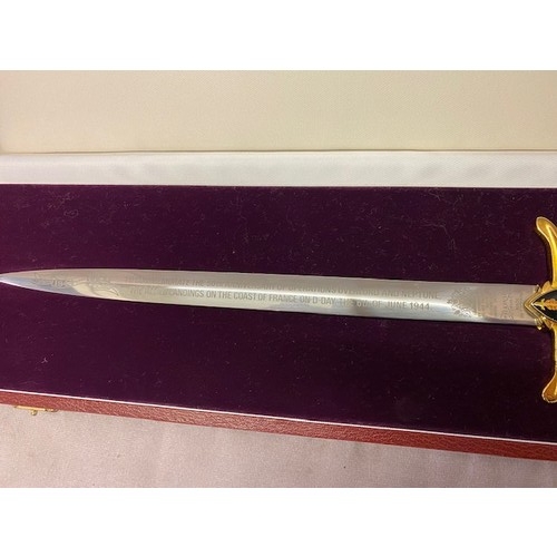 321 - A Wilkinson Sword miniature sword to commemorate D Day, in fitted leather box