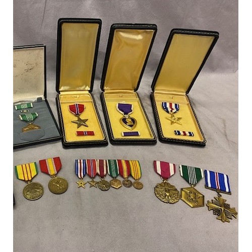 322 - An American Purple Heart, Bronze Star, Silver Star and Military Merit medal, each in leather box and... 