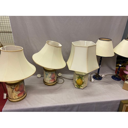 40 - A pair of modern Tole ware style tablelamp bases decorated fruit, a pair of blue and gold candlestic... 