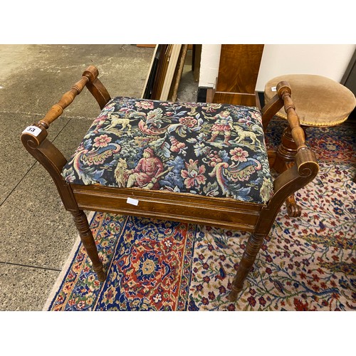 33 - An Edwardian mahogany finished piano stool with hinged seat, on ring turned tapering legs and a maho... 