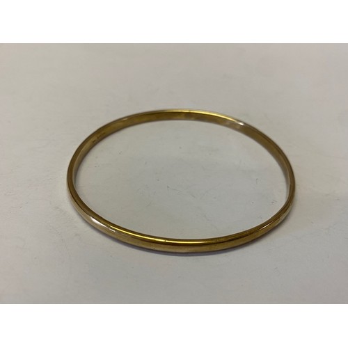 222 - A plain 9ct. gold bangle