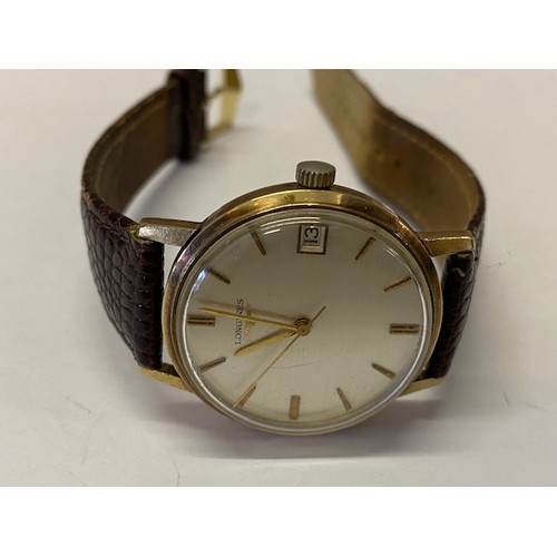 225 - A gentleman's Longines wristwatch in a gold coloured metal case, on a brown skin effect leather stra... 