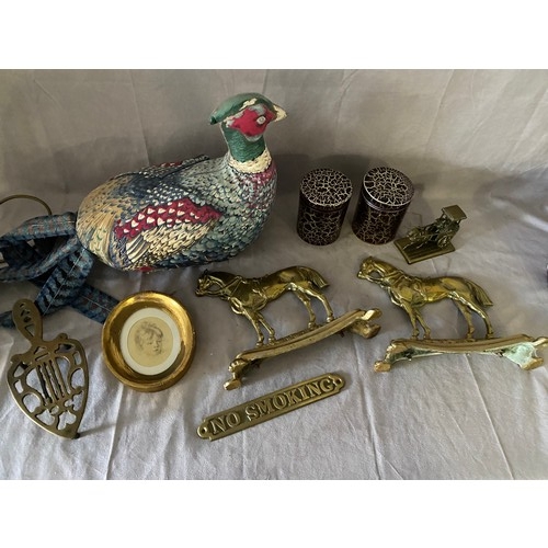 275 - A selection of brass including a pair of  candlesticks, jug, fire dogs in the form of horses, trivet... 