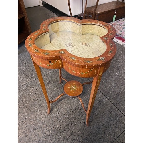 54 - An Edwardian painted satinwood bijouterie table with quatrefoil shaped top, on slender legs united b... 