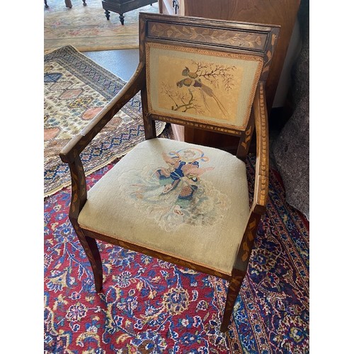 56 - An antique Dutch marquetry armchair with upholstered seat and back pad, on sabre legs