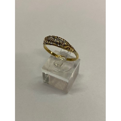 272 - A lady's ring set five diamonds, on an 18ct. gold shank