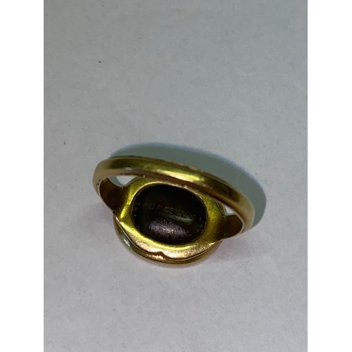 273 - A Georgian gold ring, the top set with hardstone seal, the shank dated June 7th 1814