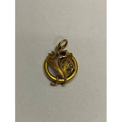 270 - A Victorian 15ct. gold pendant of flower and leaf form set ruby and two diamonds