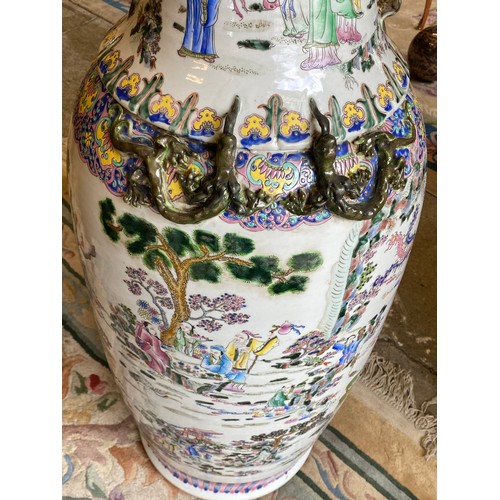 116 - A pair of large reproduction Chinese vases decorated figures, horses and flowers, on wooden stands -... 