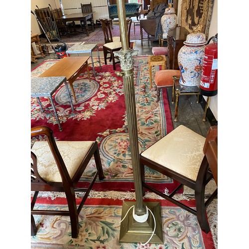 42 - A brass floor standing oil lamp with adjustable Corinthian column converted to electricity