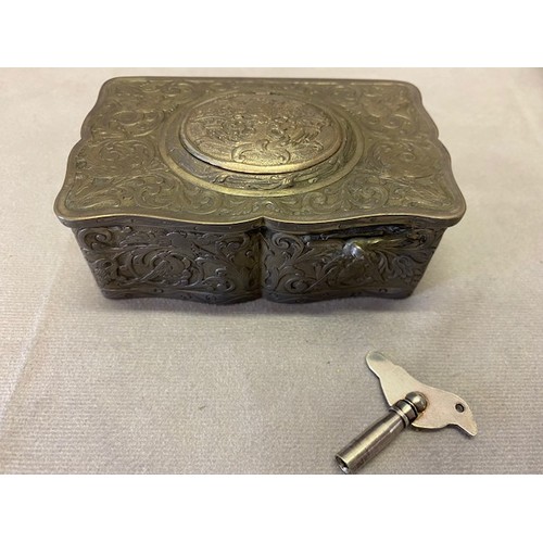 278 - A singing bird musical box in a German silver case of serpentine outline with repousse decoration of... 