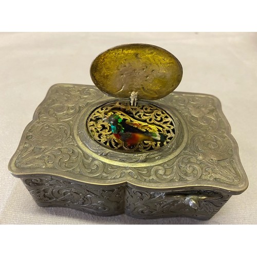 278 - A singing bird musical box in a German silver case of serpentine outline with repousse decoration of... 