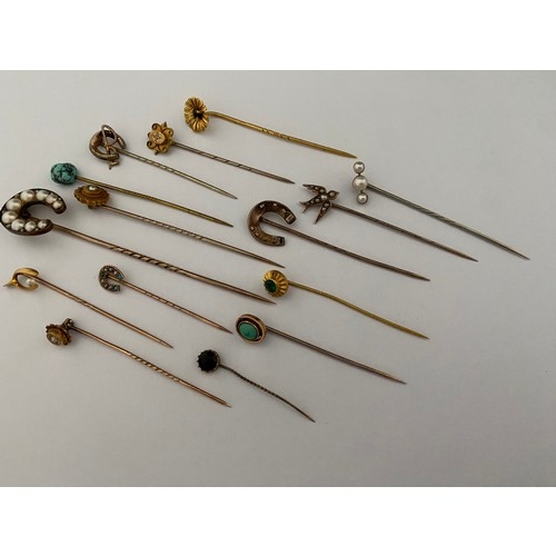 293 - A selection of gold, gold coloured metal and other stick pins set stones, pearls, paste etc..