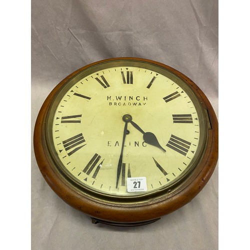 27 - A wall clock by H Winch of Broadway Ealing, in a mahogany case - 15in. dia.