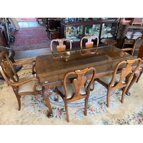 36 - A walnut dining room suite comprising:- dining table with carved edge, on leaf carved cabriole legs,... 