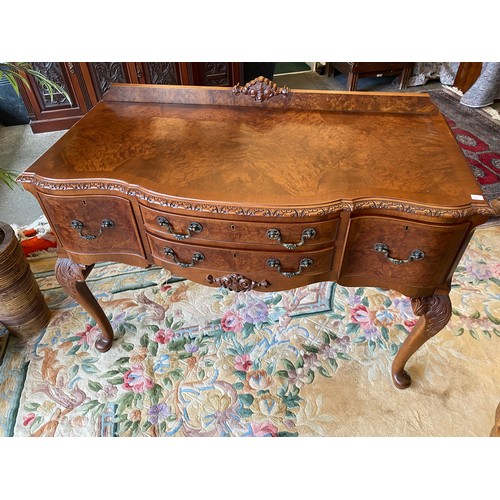 36 - A walnut dining room suite comprising:- dining table with carved edge, on leaf carved cabriole legs,... 