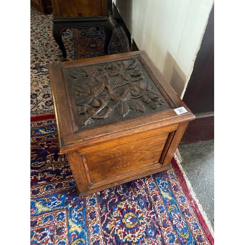 37 - A Victorian oak sewing box of square form with carved lid - 14 1/2in. square