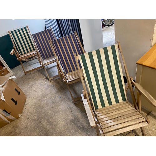 63 - Four wooden folding deck chairs