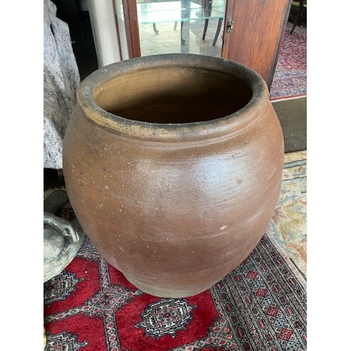 60 - A large brown glazed pottery garden urn - 29in. high