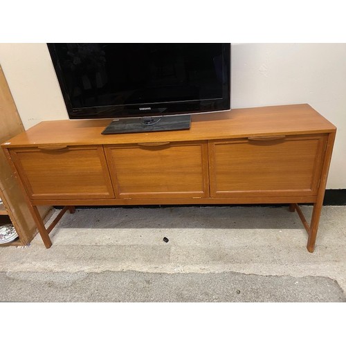 35 - A teak sideboard fitted centre hinged compartment flanked to each side by a door, on square legs - 7... 