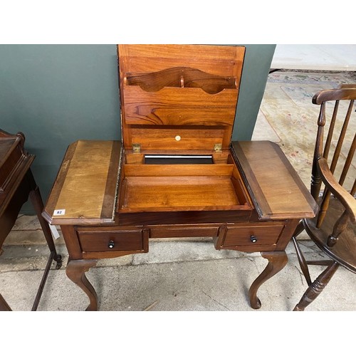 82 - A mahogany writing table fitted centre compartment, three drawers to the frieze, on cabriole legs - ... 