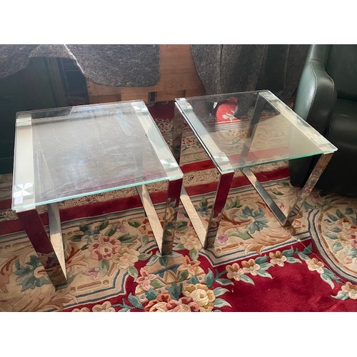 91 - A large brushed chrome coffee table with inset glass top and a pair of chrome framed coffee tables w... 