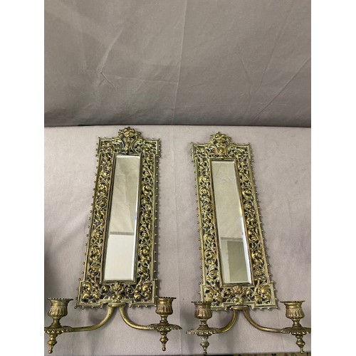 326 - A pair of rectangular brass framed wall mirrors with pierced frames and candle arms