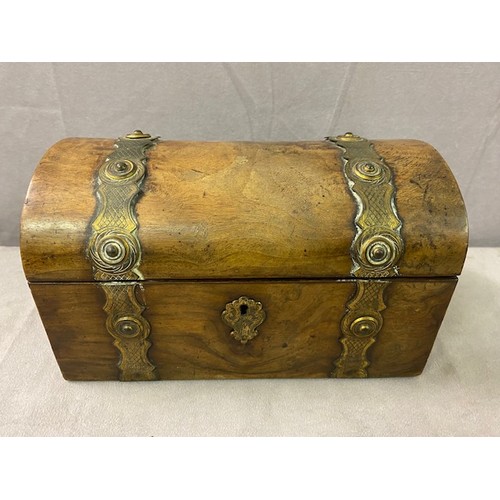 343 - A Victorian walnut casket with dome shaped top, brass strapwork decoration