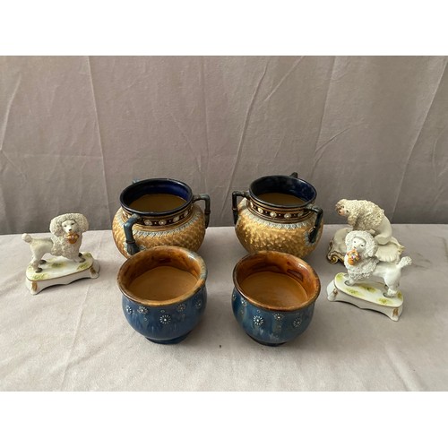 227 - A pair of Royal Doulton cauldrons, blue necks, gold chine ground, on three feet, a pair of Staffords... 