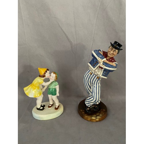 172 - A Royal Doulton figure - The Hornpipe HN2161 and a Staffordshire group of a young girl and boy, on o... 