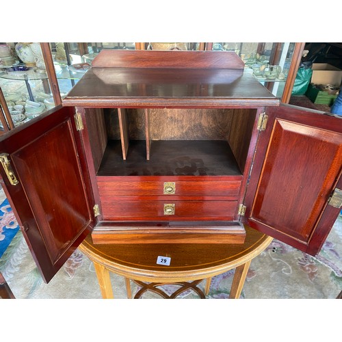 36 - An Edwardian mahogany and inlaid smokers cabinet fitted two panelled doors with shell inlaid decorat... 