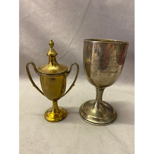 279 - A silver presentation goblet and a small silver gilt urn form double handled trophy cup