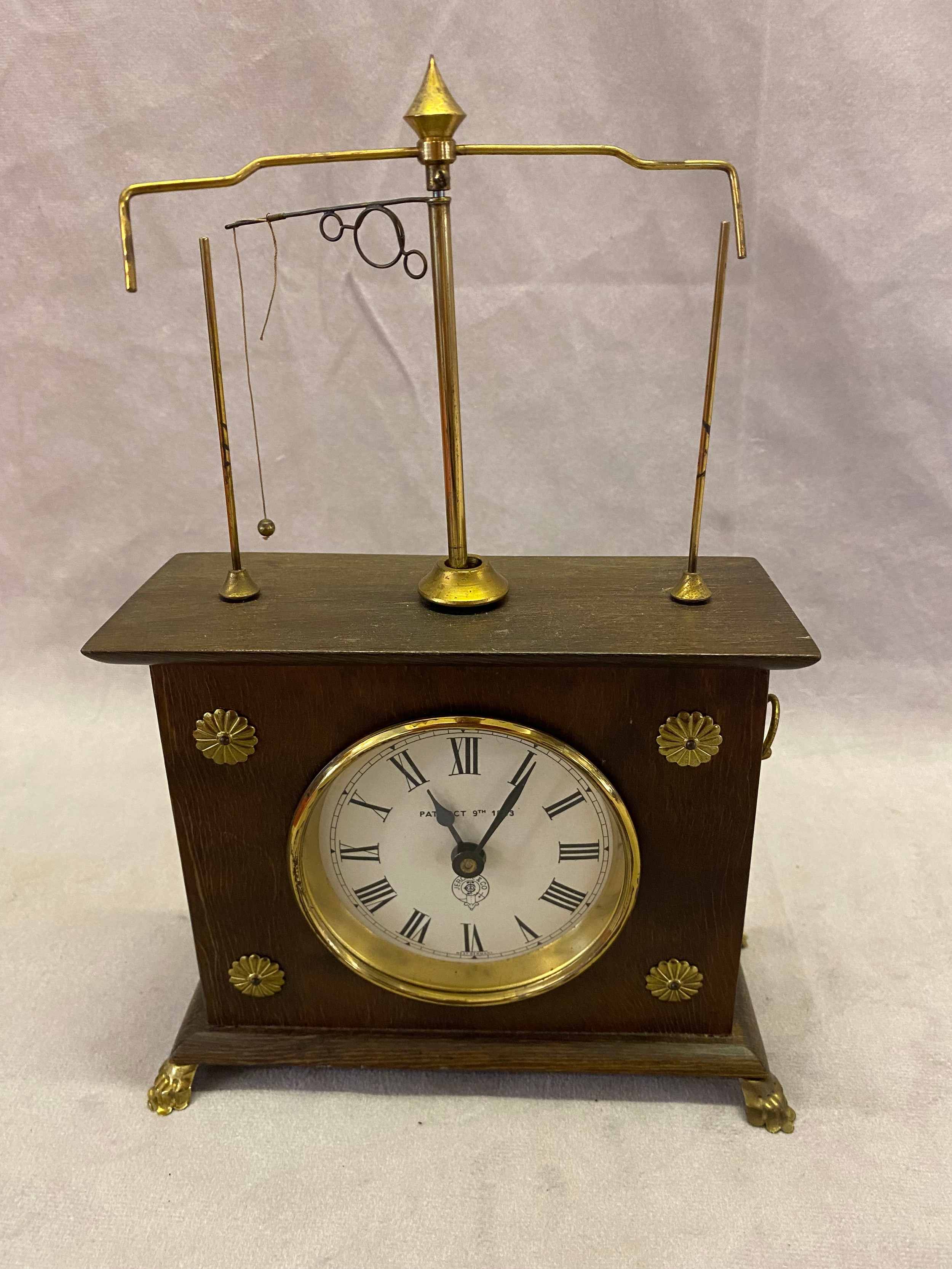 A Jerome and Co. flying ball clock in a mahogany case