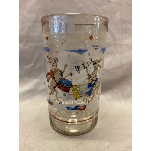 146 - An antique German beaker painted in enamels with two hares, one playing a drum, the other drinking, ... 