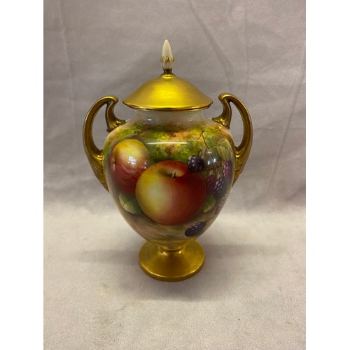 78 - A Royal Worcester urn form covered vase, the gilt lid with cream pointed finial, the body fitted twi... 