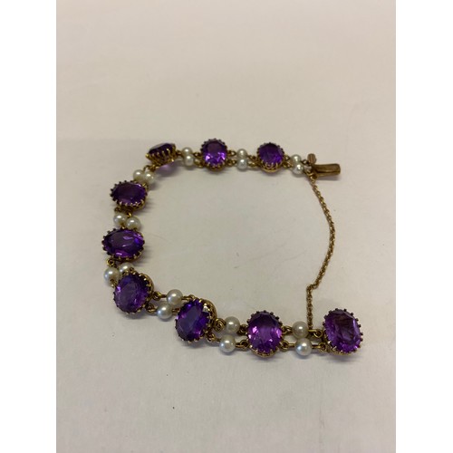 212 - A 9ct. gold bracelet set amethysts with twin pearl spacers